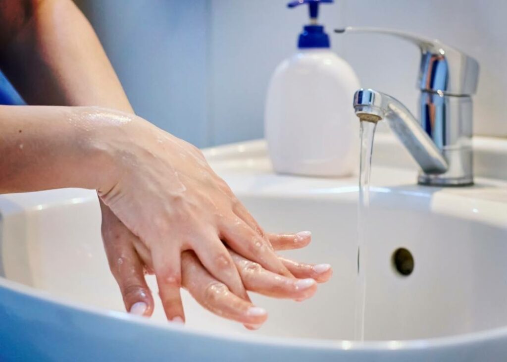 Woman washing her hands close up