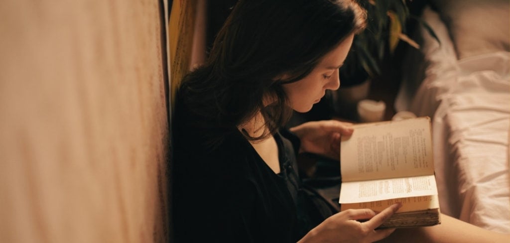Woman reading the Bible and contemplating