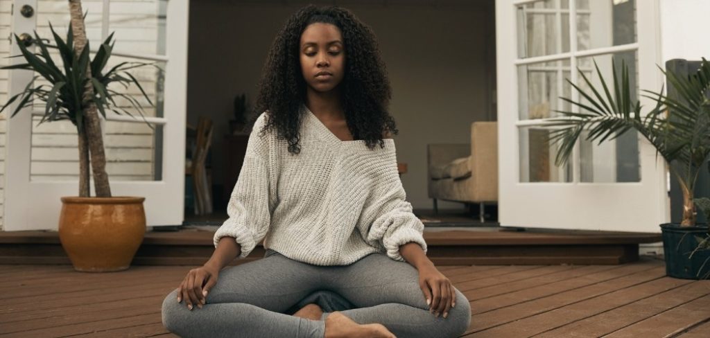 Woman outside meditating practicing different types of meditation practices