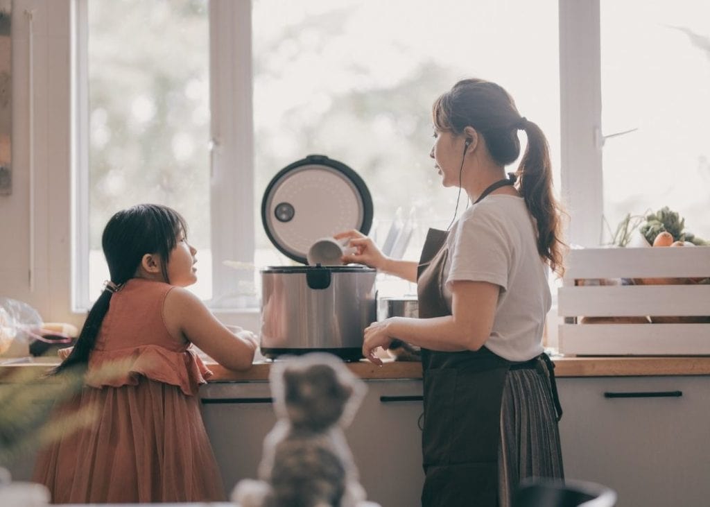 Rice cooker with mom and daughter