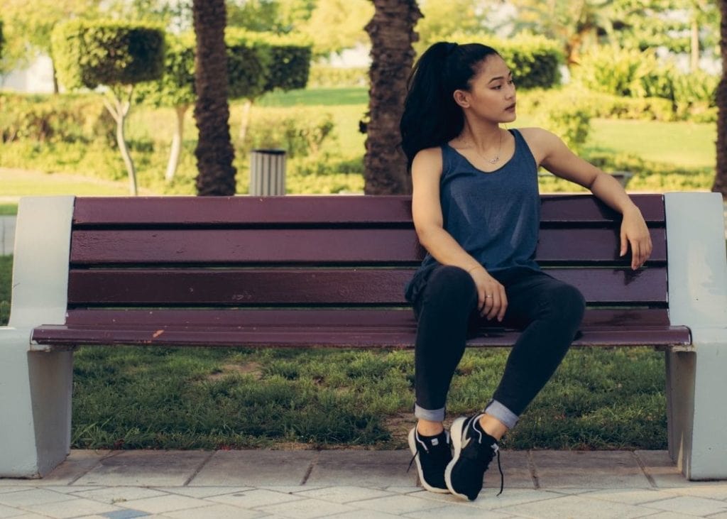 Sit on a park bench and observe mindfully like Forrest Gump