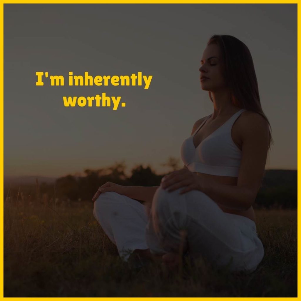 Woman meditating with the text 'I'm inherently worthy'