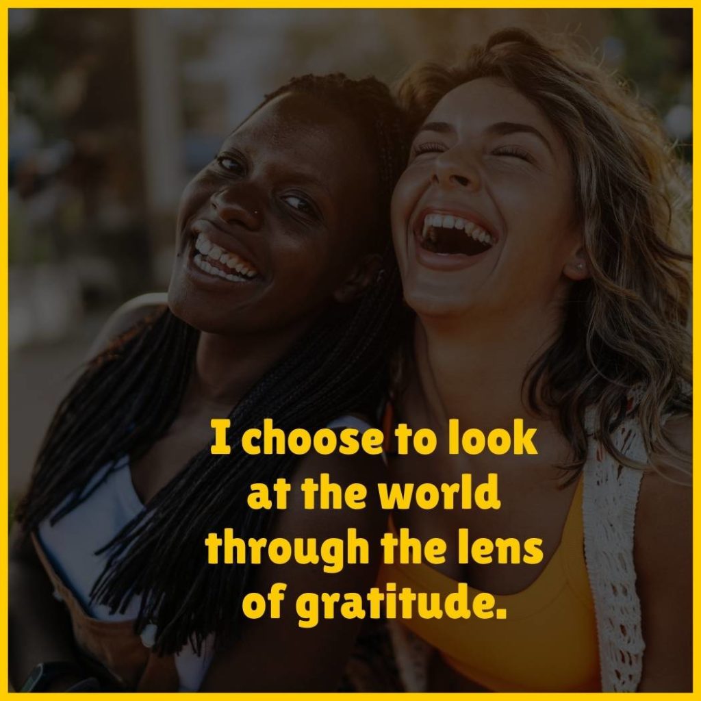 Two women laughing with the text 'I choose to look at the world through the lens of gratitude.'
