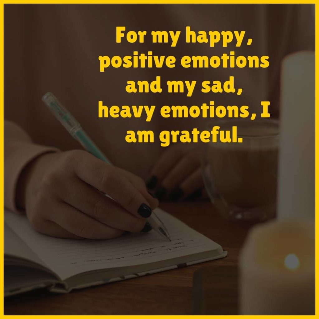 Image of woman journaling with the text 'For my happy, positive emotions and my sad, heavy emotions, I am grateful'